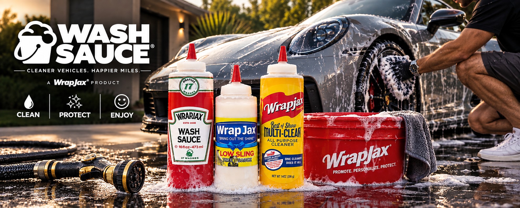 Wash Sauce bottles sitting on ground in front of Porsche 911
